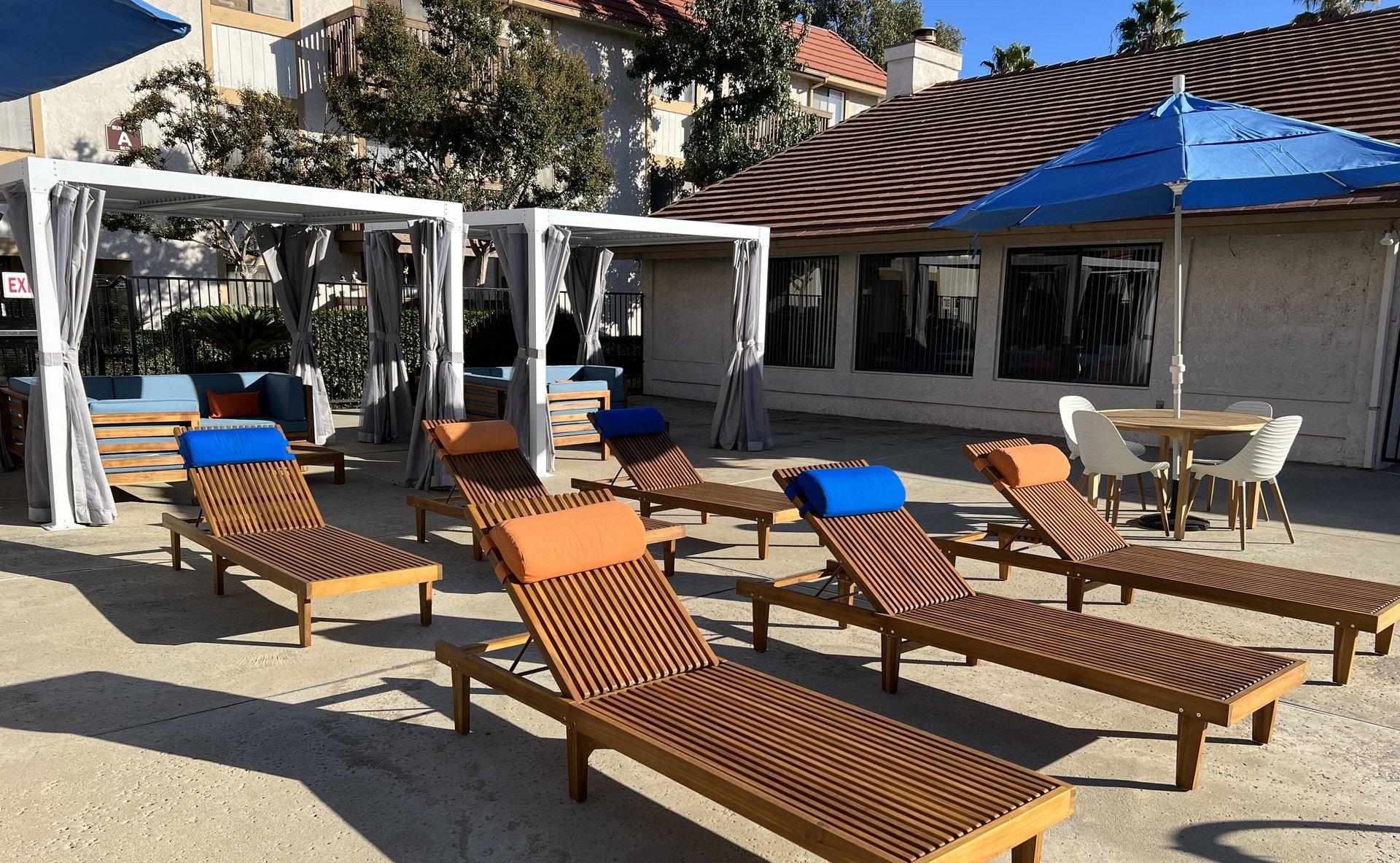 a group of lawn chairs sitting on top of a picnic table