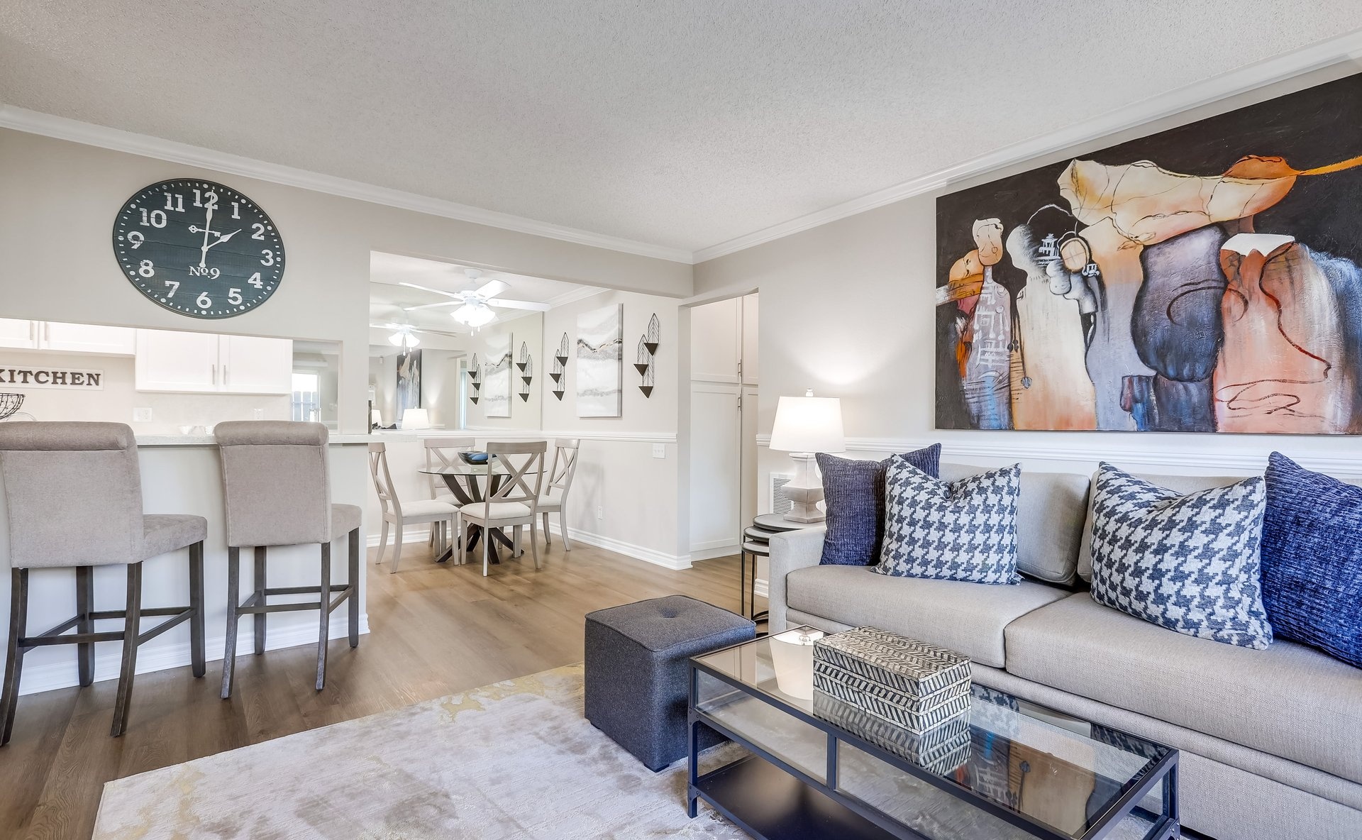 a living room filled with furniture and a flat screen tv