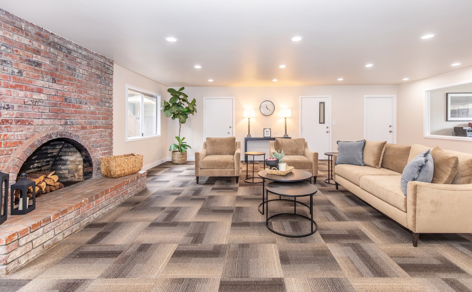 a living room filled with furniture and a fireplace