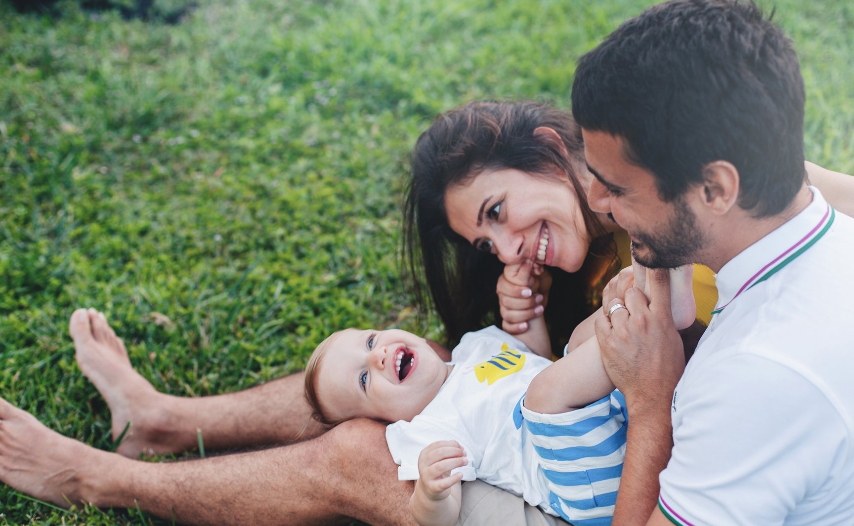 Family in park playing on grass