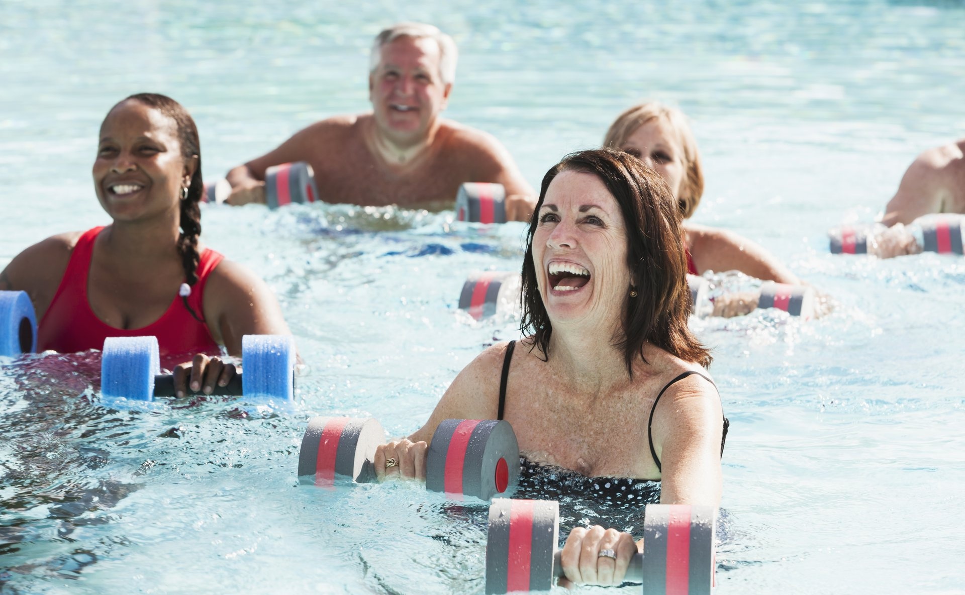 a group of people sitting at a beach