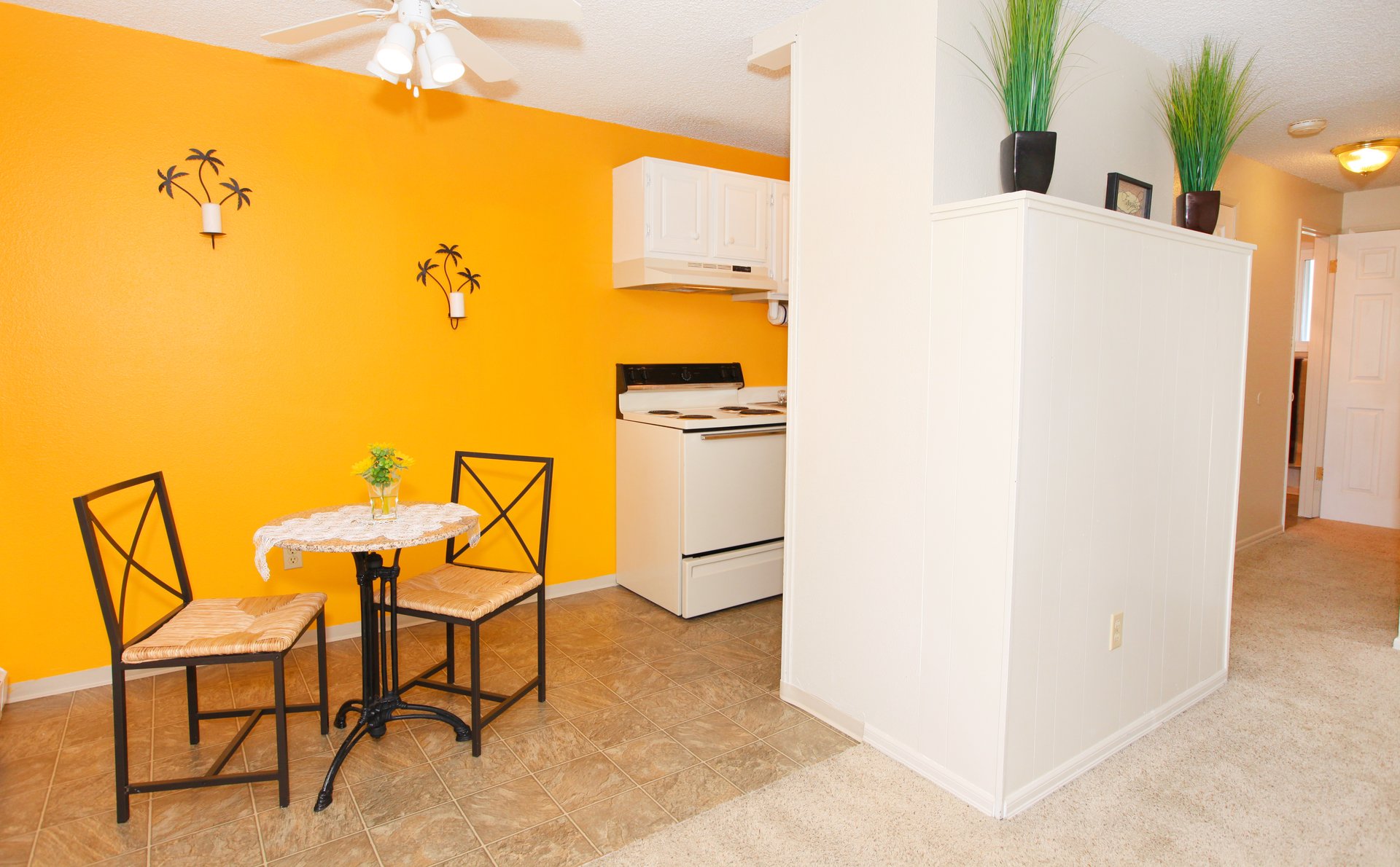 a room filled with furniture and a refrigerator