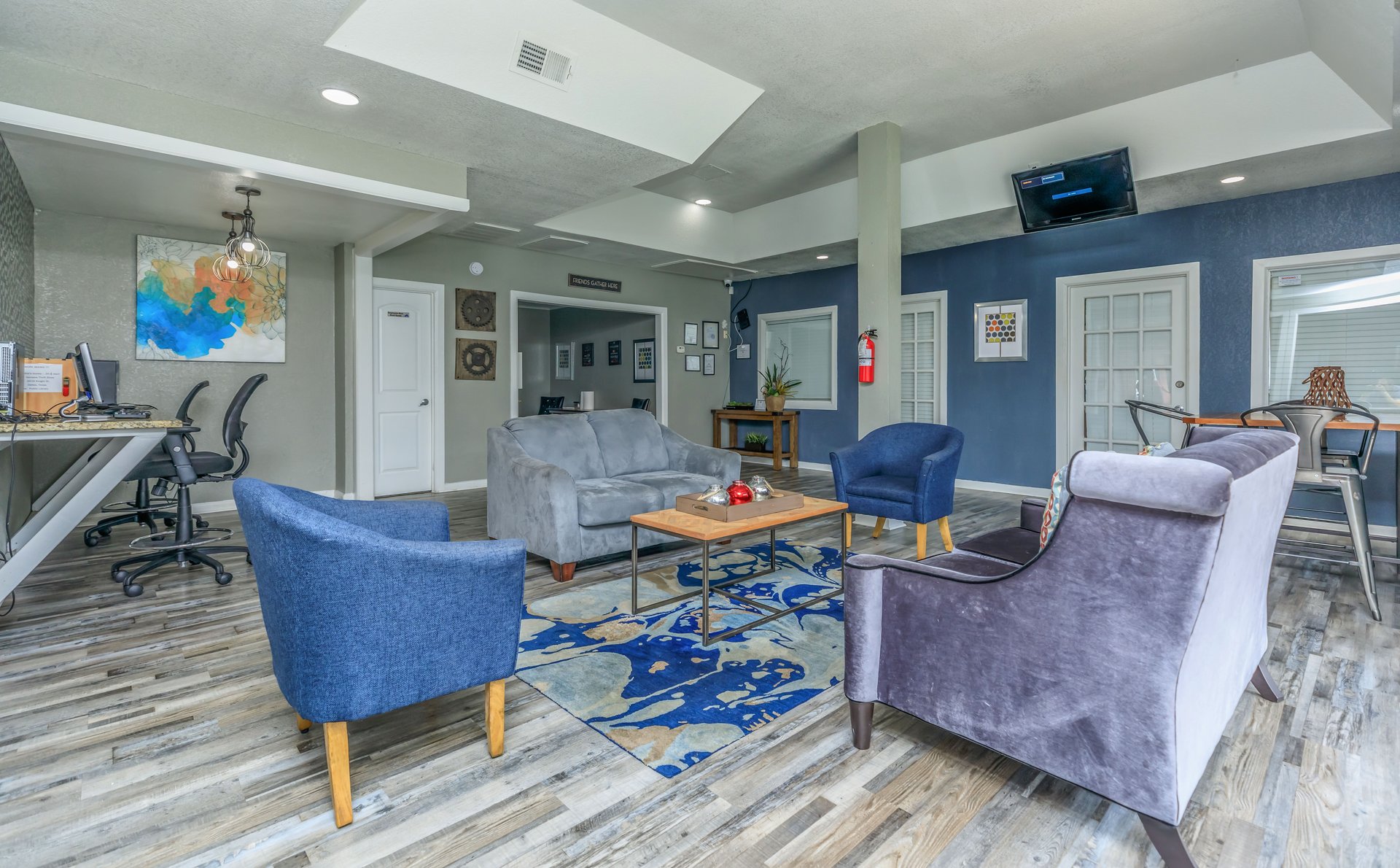 a living room filled with furniture and a rug