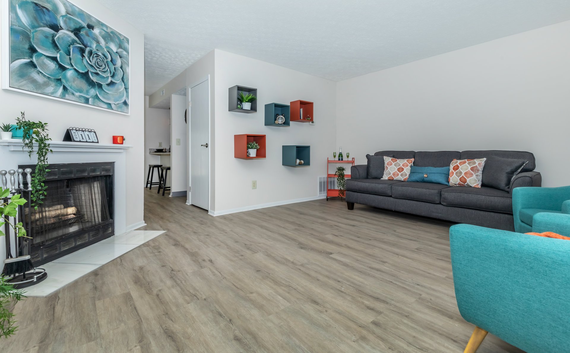 a living room filled with furniture and a flat screen tv