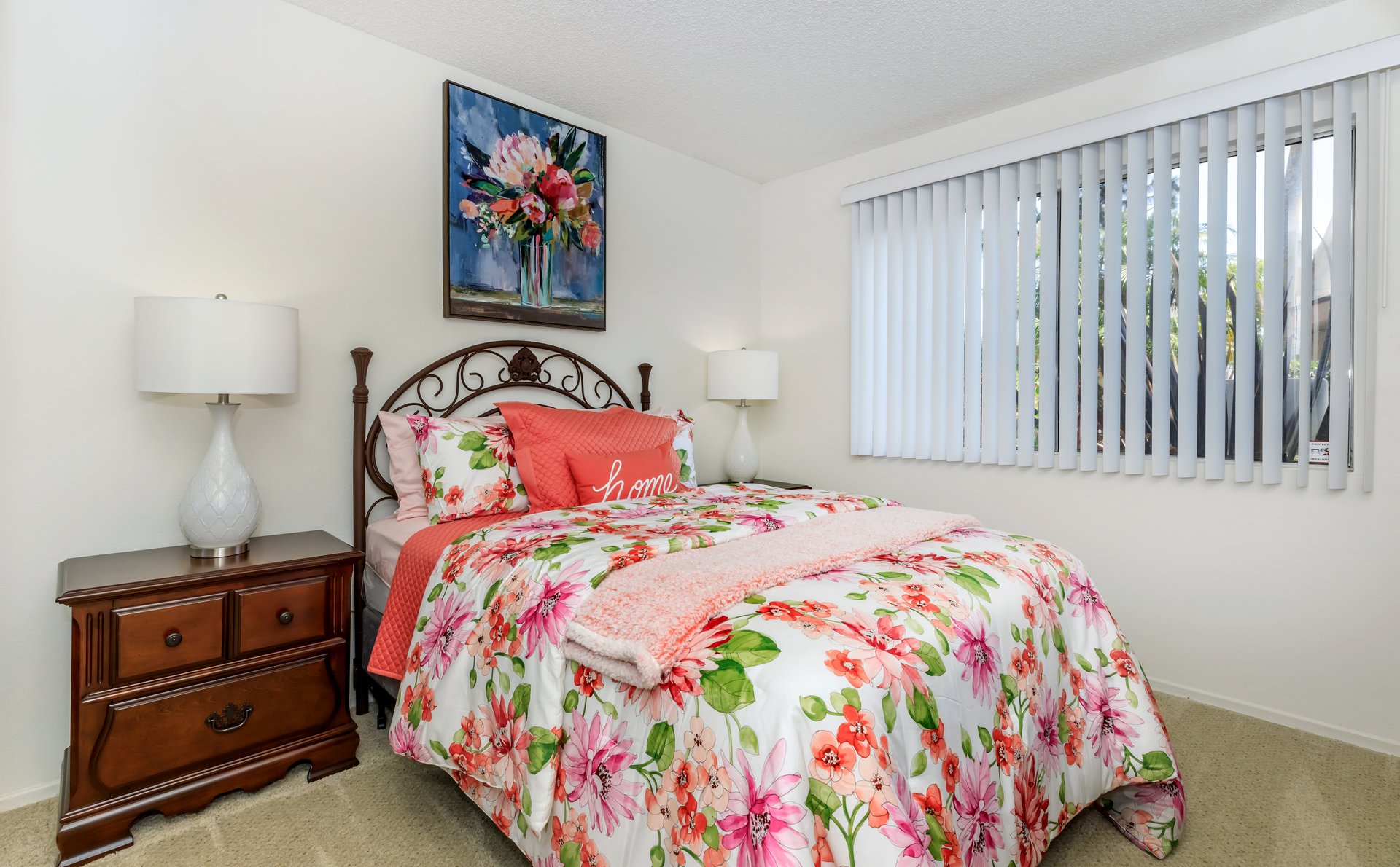 a bedroom with a bed in a room