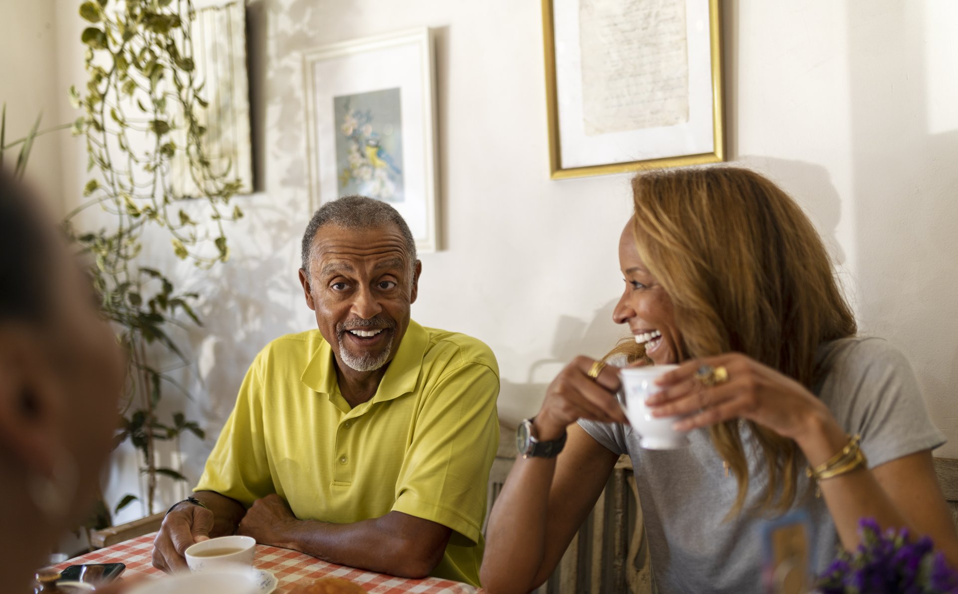 a man and a woman sitting at a table eating food
