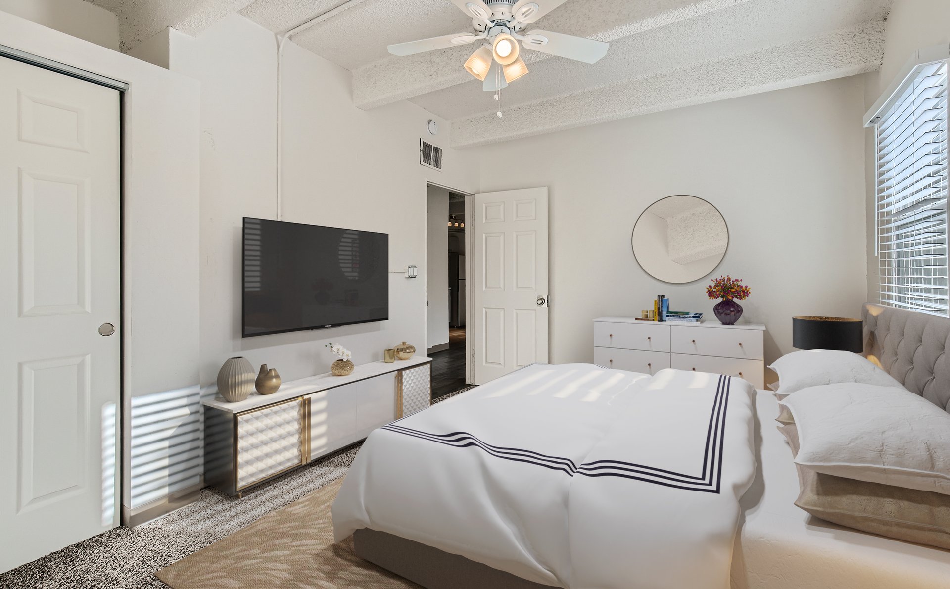 a bedroom with a bed in a room