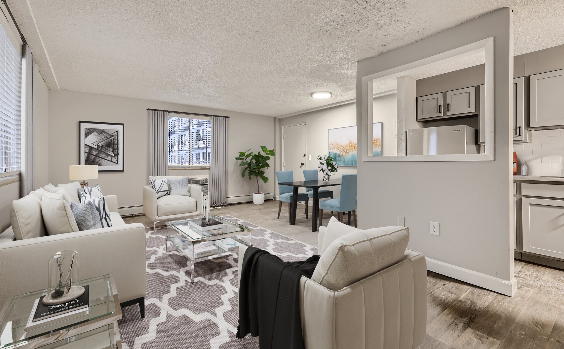 a living room filled with furniture and a large window