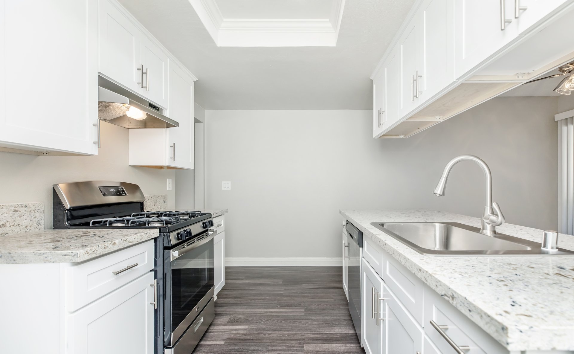 a kitchen with a stove and a sink