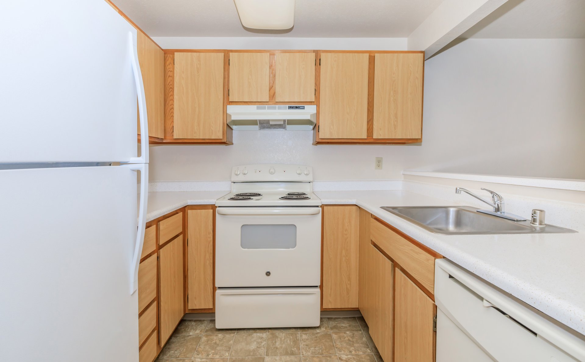 a kitchen with a stove top oven sitting inside of a refrigerator