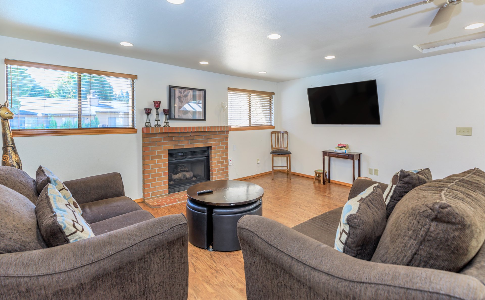a living room filled with furniture and a flat screen tv
